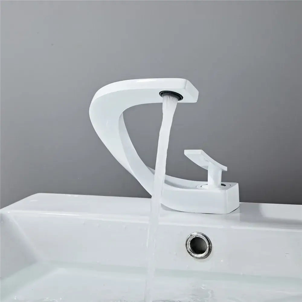 Modern gold waterfall mixer bathroom faucet with white sleek curved design and single handle in modern style