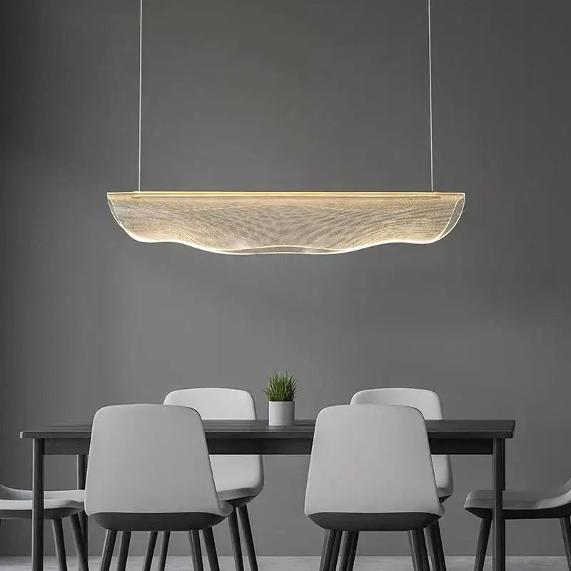 Modern gold wave mesh pendant light with warm glowing illumination made of translucent material for dining room decorbites dining room