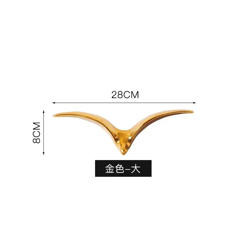 Modern gold and white ceramic bird pendant wall decor with sleek finish and outstretched wings for living room