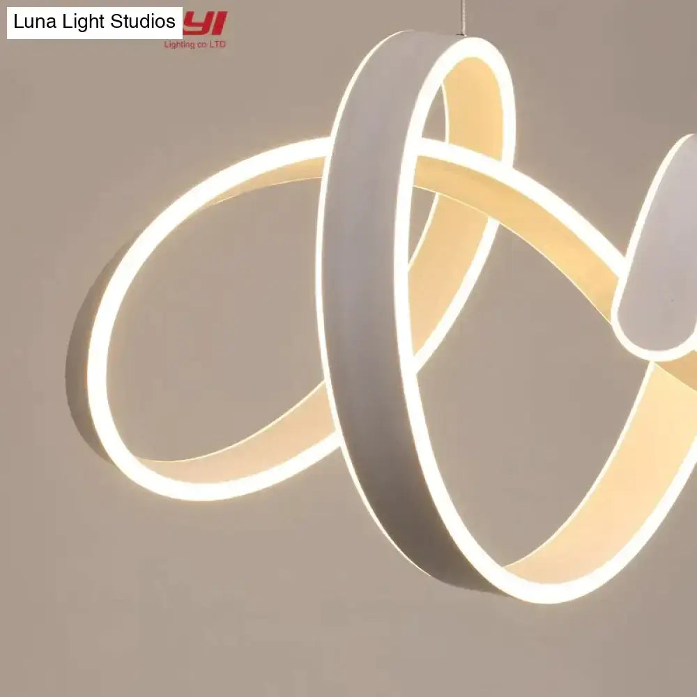 Modern gold and white led pendant lights featuring a sleek white led chandelier with interlocking circular rings