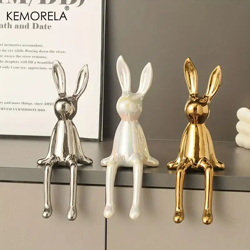 Three glossy ceramic sitting rabbit ornaments in gold white and silver finishes for modern living room decor