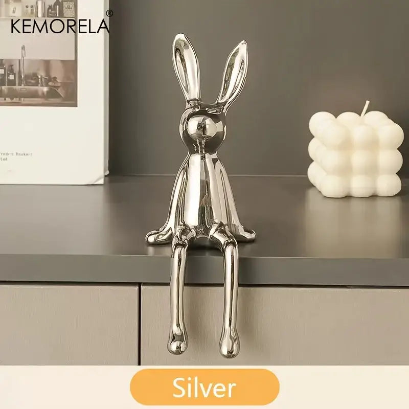 Silver metallic sitting rabbit ornament with sleek minimalist design for modern living room decor