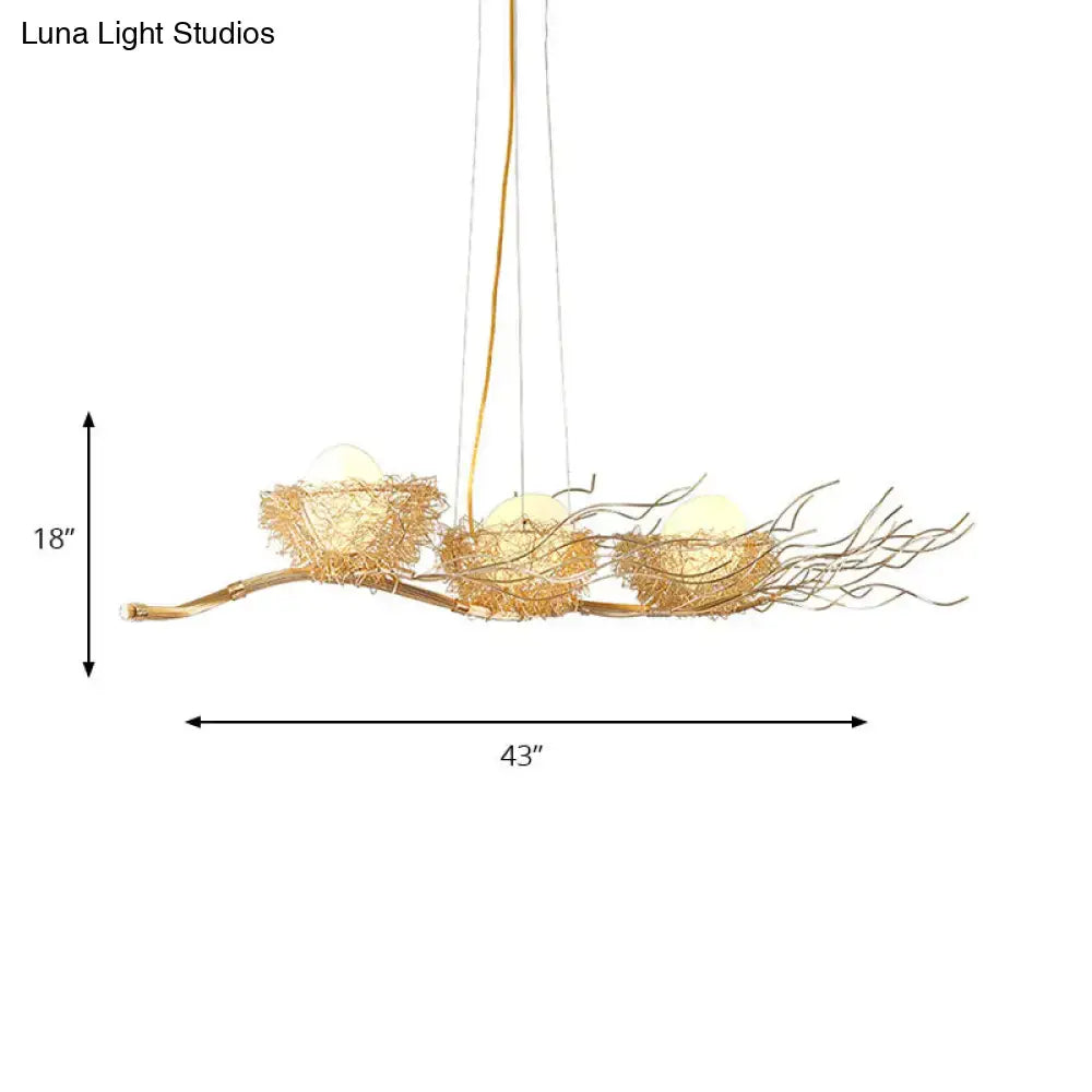 DecorBites gold wire mesh bird nest chandelier with three woven mesh bird nests and glowing orbs for island lighting