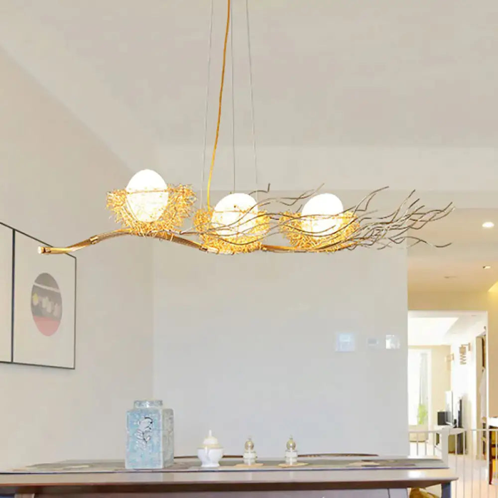 Decorbites gold wire mesh bird nest chandelier with three white glass bulbs in woven mesh bird nest design