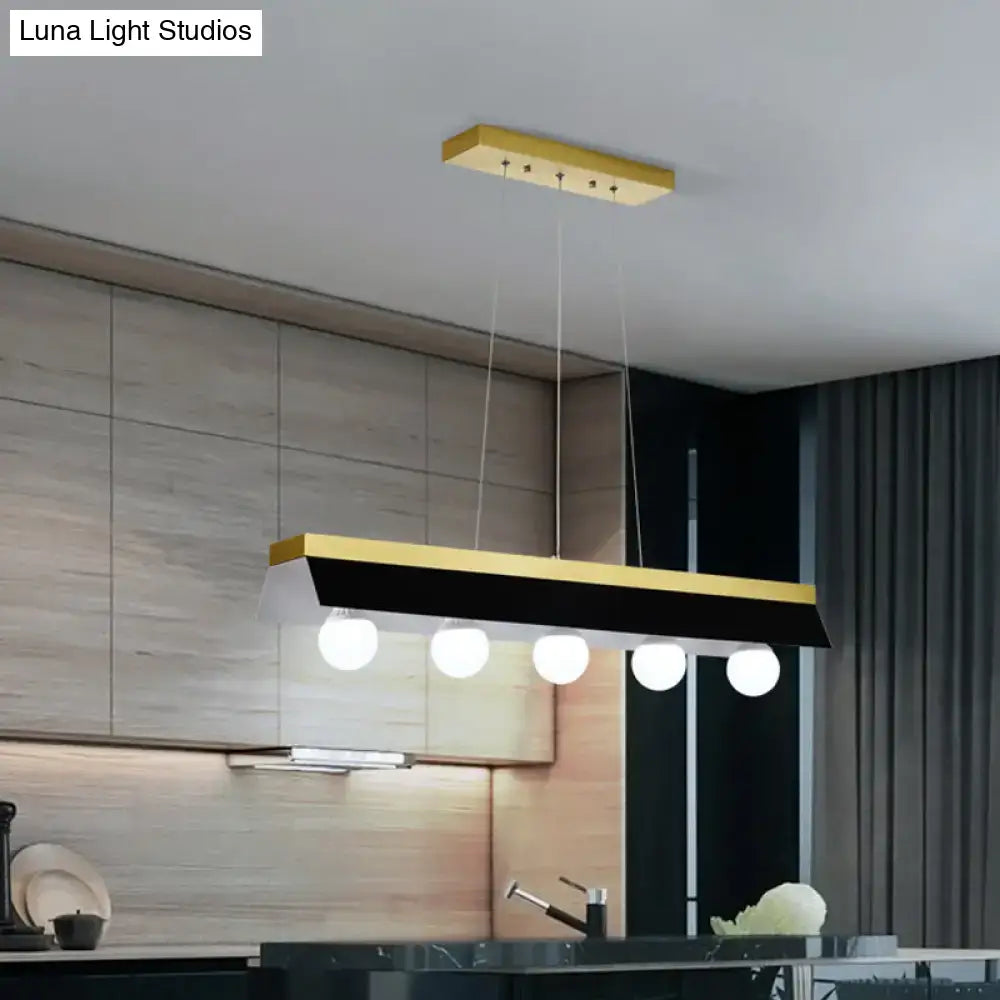 Modern wood island billiard light by DecorBites with sleek black white shade and five white spherical LED bulbs for restaurants
