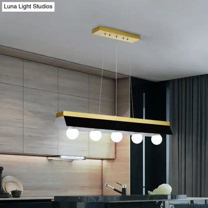 Modern wood island billiard light by DecorBites with sleek black white shade and five white spherical LED bulbs for restaurants