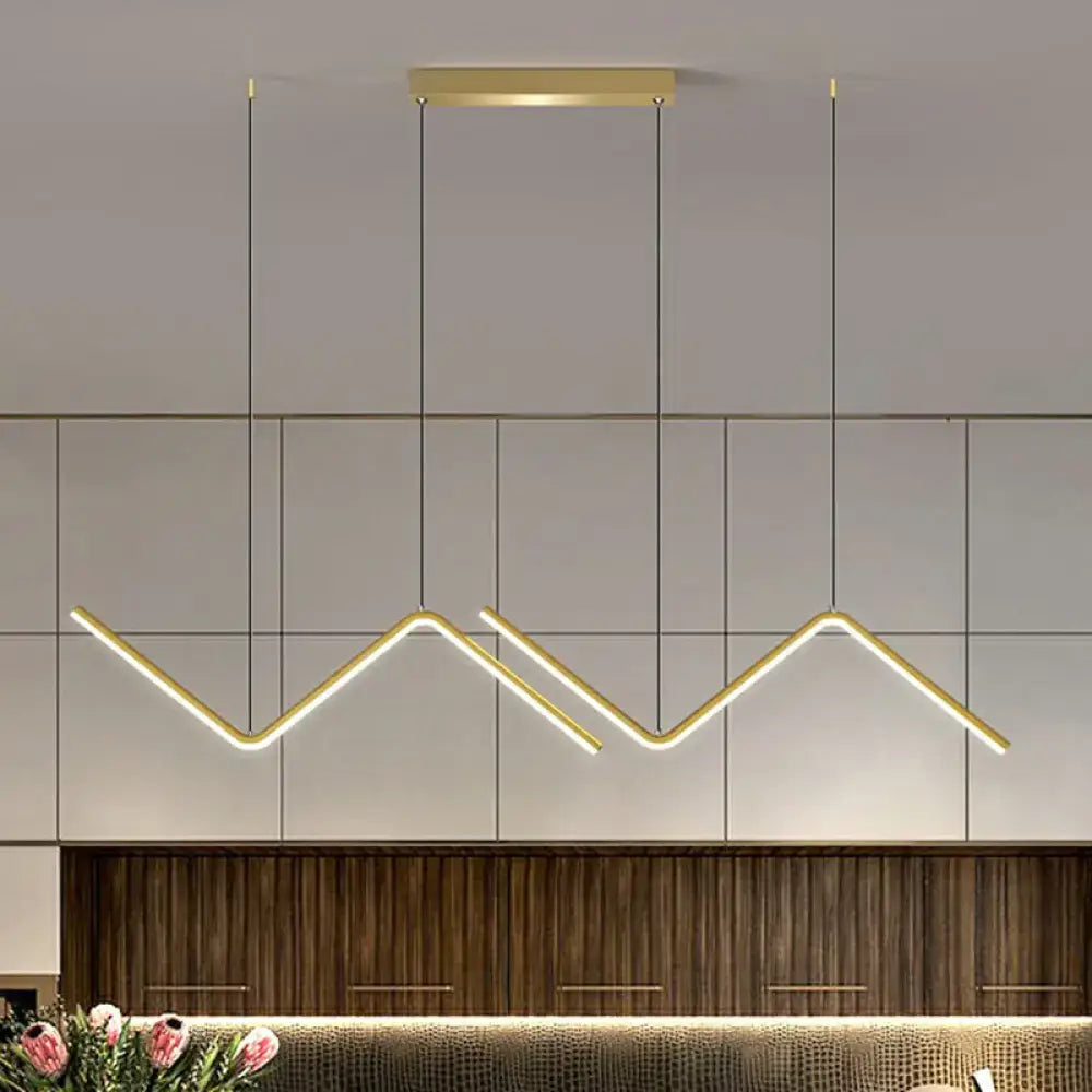 DecorBites minimalist gold-toned z-shaped island pendant light fixture with warm glow for dining room lighting
