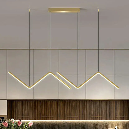 DecorBites minimalist gold-toned z-shaped island pendant light fixture with warm glow for dining room lighting