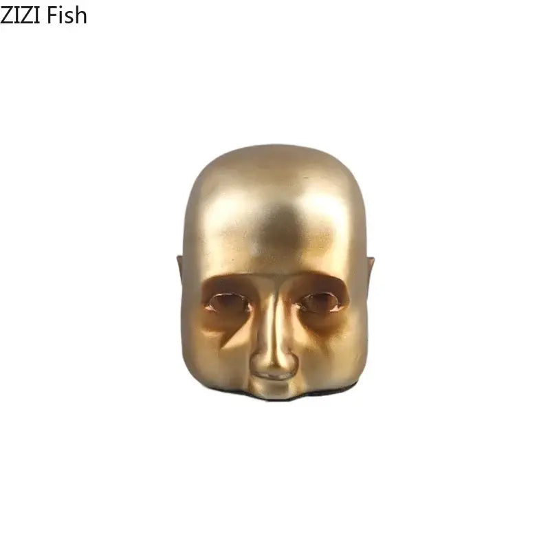 Modern golden abstract resin sculpture with smooth reflective surface as decorbites abstract resin office desk decorbites ornament