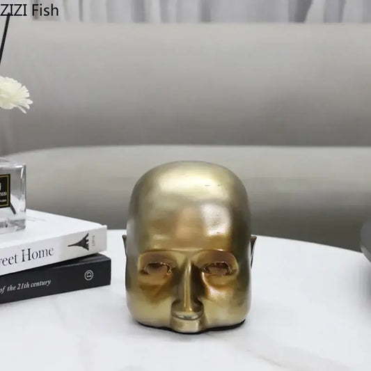 Modern golden abstract resin sculpture of a bald human head with smooth reflective surface for office desk decorbites abstract resin ornament
