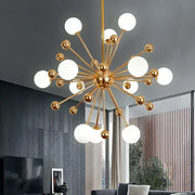 Modern golden acrylic molecule chandelier featuring gold-toned metal and spherical white glass globes for kitchen decorbites golden acrylic lighting