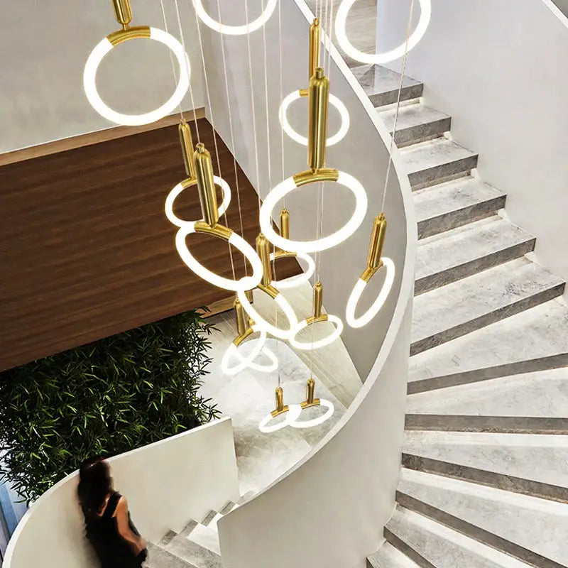 Modern golden acrylic round led chandelier featuring gold-toned circular pendant lights with illuminated rings for living room decorbites golden acrylic
