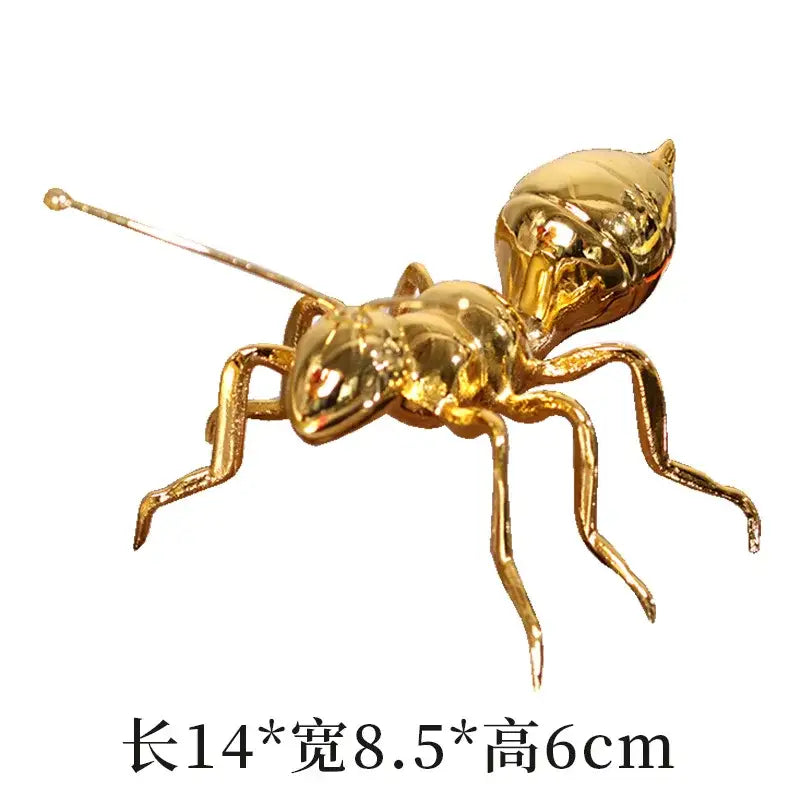 Shiny gold decorbites golden ant metal sculpture with detailed segmented body and articulated legs for living room decor