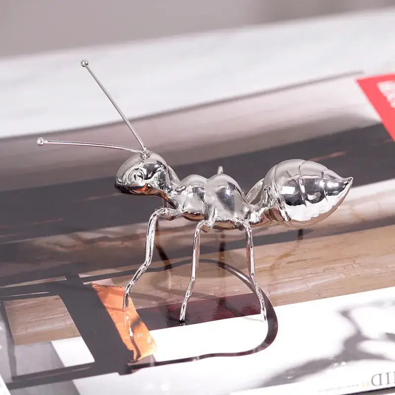 Shiny silver metallic ant figurine metal sculpture with detailed segmented body and articulated legs for modern decorbites golden ant decor