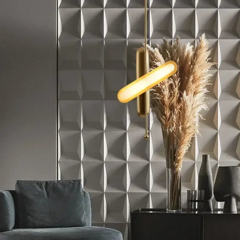 Modern golden art deco iron chandelier pendant light with a gold-toned minimalist elongated oval shade and thin rods