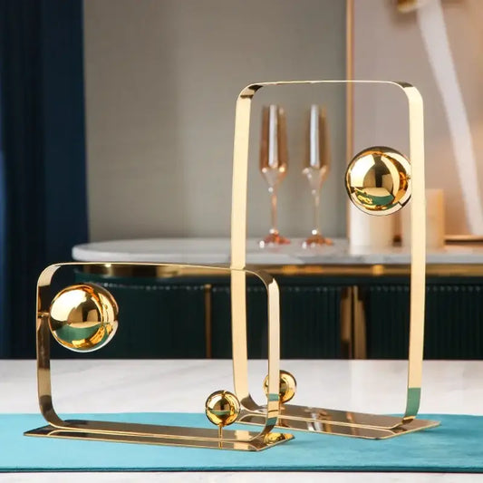 Modern golden ball cube sculpture with gold-toned metallic geometric design and polished spherical accents for living room decor