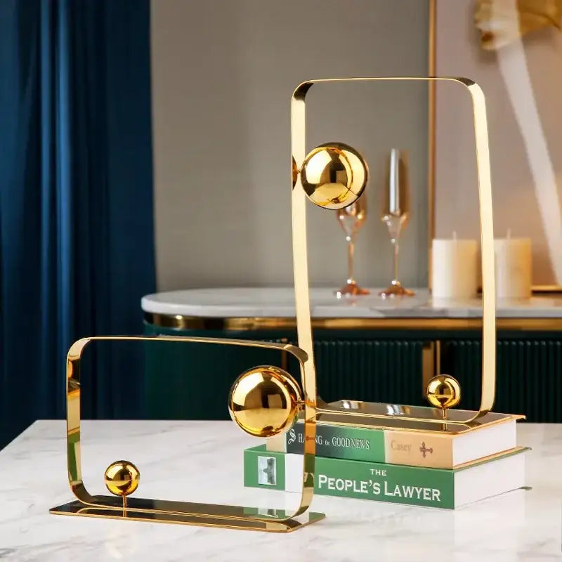 Modern golden ball cube sculpture featuring gold-toned geometric frames and polished spherical accents for living room decorbites golden ball decor