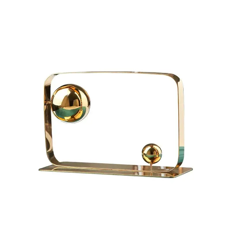 Modern golden ball cube sculpture with two polished spheres on curved metallic frame for living room decorbites decor