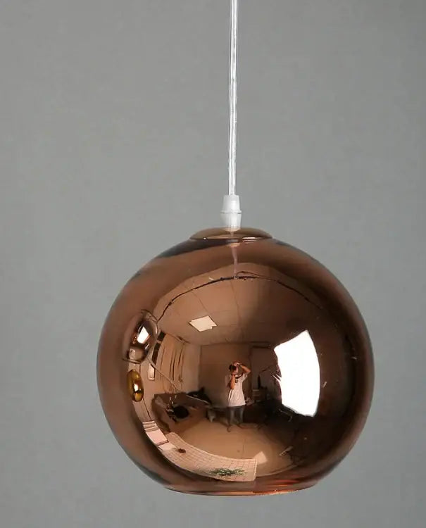 Modern golden ball glass pendant light with reflective copper finish and white cord suspension for decorbites pendant light