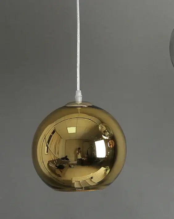 Modern golden ball glass pendant light with polished gold finish and reflective surface for elegant kitchen decorbites pendant light