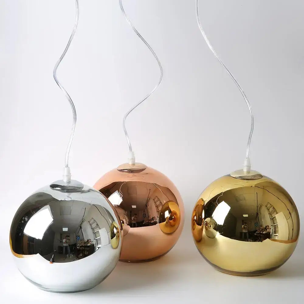 Modern golden ball glass pendant light trio with reflective silver rose gold and gold finishes for kitchen decorbites pendant light