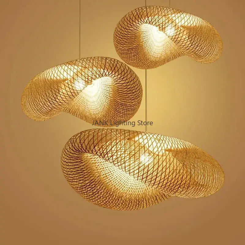 Three golden woven bamboo wave shade pendant lamps with a modern swirling design for dining room lighting