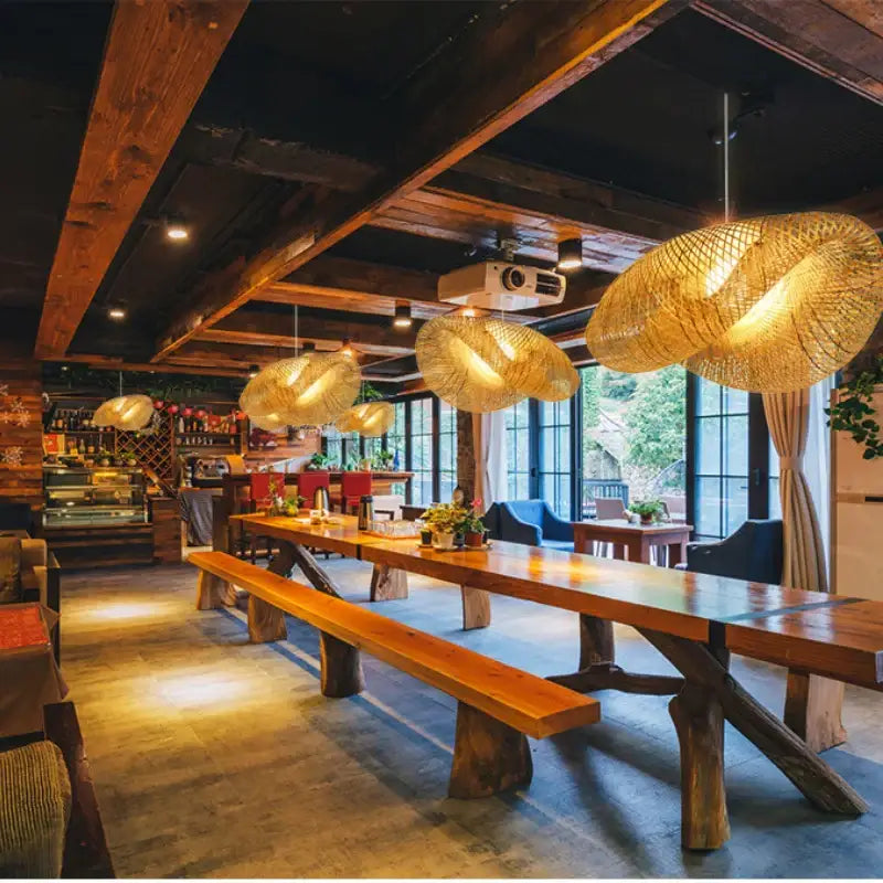 Warm golden bamboo woven chandelier pendant lights hanging from the ceiling for modern tea room decor