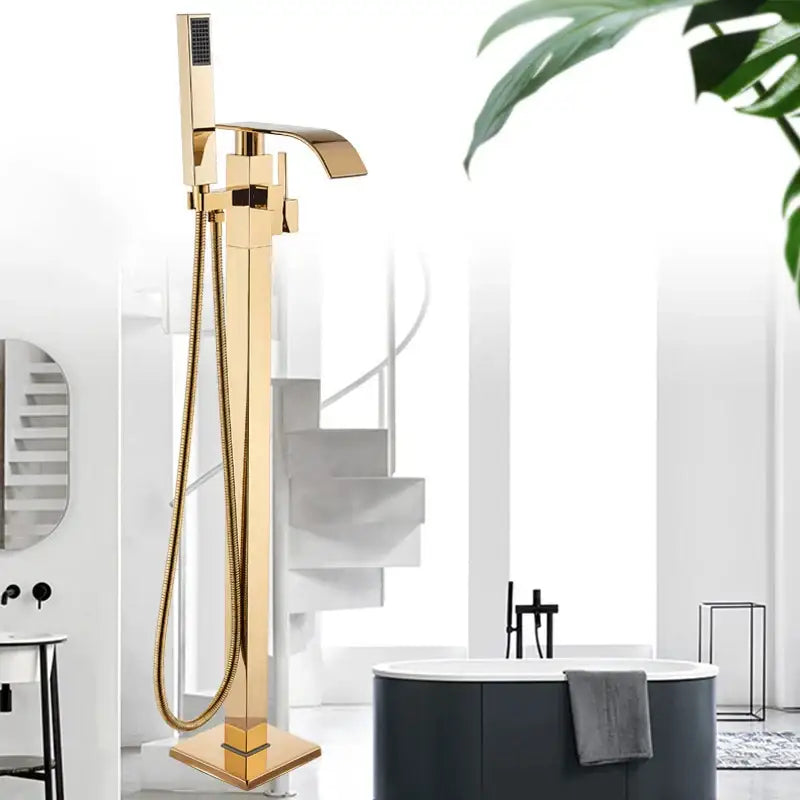 Modern golden bathtub shower freestanding faucet with sleek rectangular design and integrated handheld showerhead by decorbites