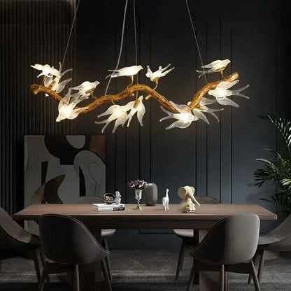 A modern golden bird crystal glass branch chandelier with translucent white bird-shaped lights for living room decorbites bird crystal