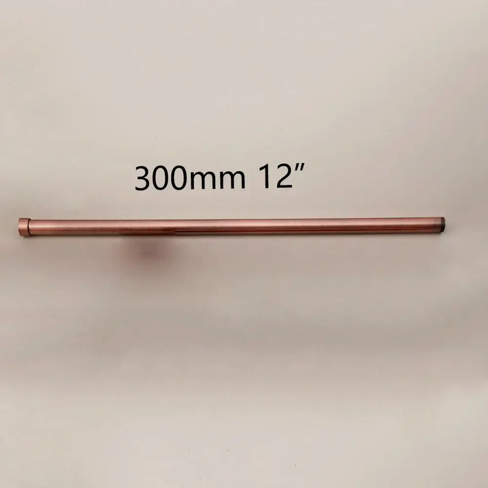A sleek 300mm copper curtain rod with rounded ends complements the decorbites golden black stainless steel shower arm extension rod