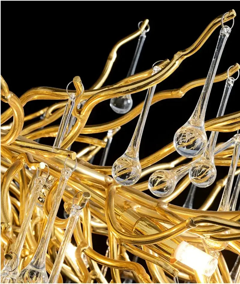 Modern golden branch crystal chandelier with intricate branching arms and clear teardrop-shaped crystal pendants for luxury decorbites lighting