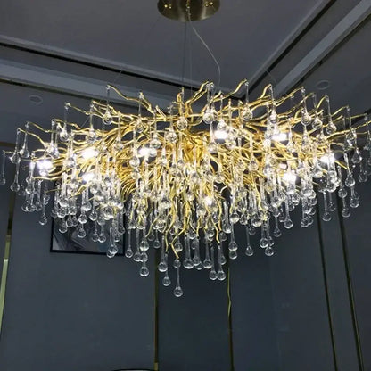 Modern golden branch crystal led chandelier with dangling teardrop pendants for elegant led living room decorbites crystal led