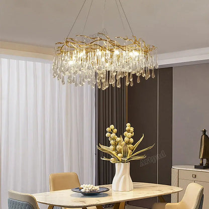 Modern golden branch led ceiling chandelier with gold-toned metal frame and cascading clear crystal droplets decorbites golden branch