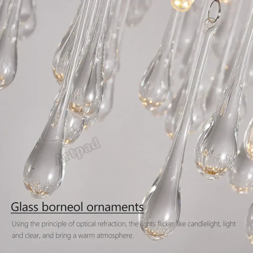 Clear glass teardrop-shaped ornaments with gold-toned base accents for decorbites golden branch led ceiling chandelier