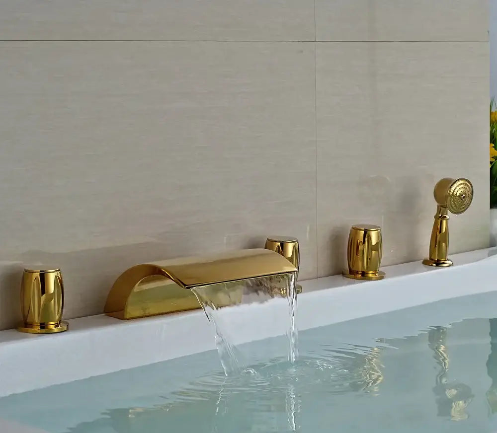 Modern golden brass bathtub faucet with matching cylindrical handles and handheld showerhead by decorbites golden brass