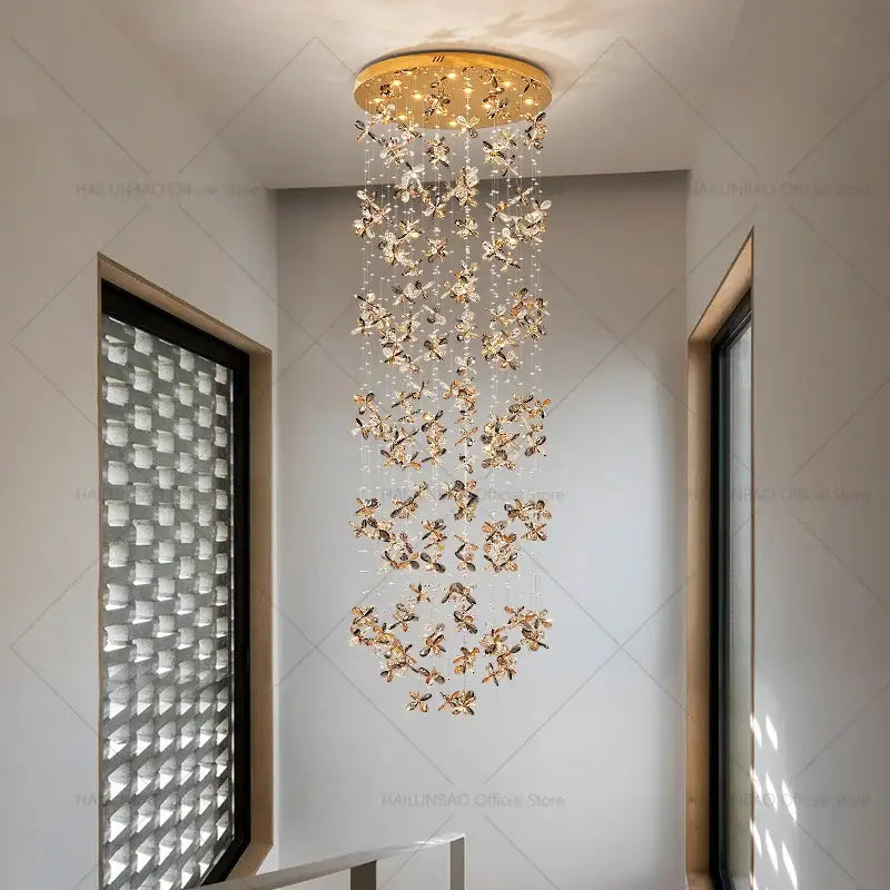 Modern golden butterfly crystal staircase chandelier lighting fixture with cascading crystal butterfly ornaments decorbites crystal staircase