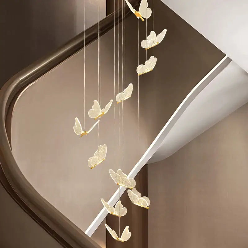 A delicate cream-colored decorbites golden butterfly led chandelier with gold-toned accents for living room decor