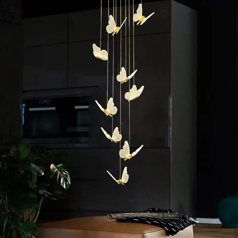 A modern golden butterfly led chandelier with translucent white wings and gold accents for living room decorbites golden butterfly