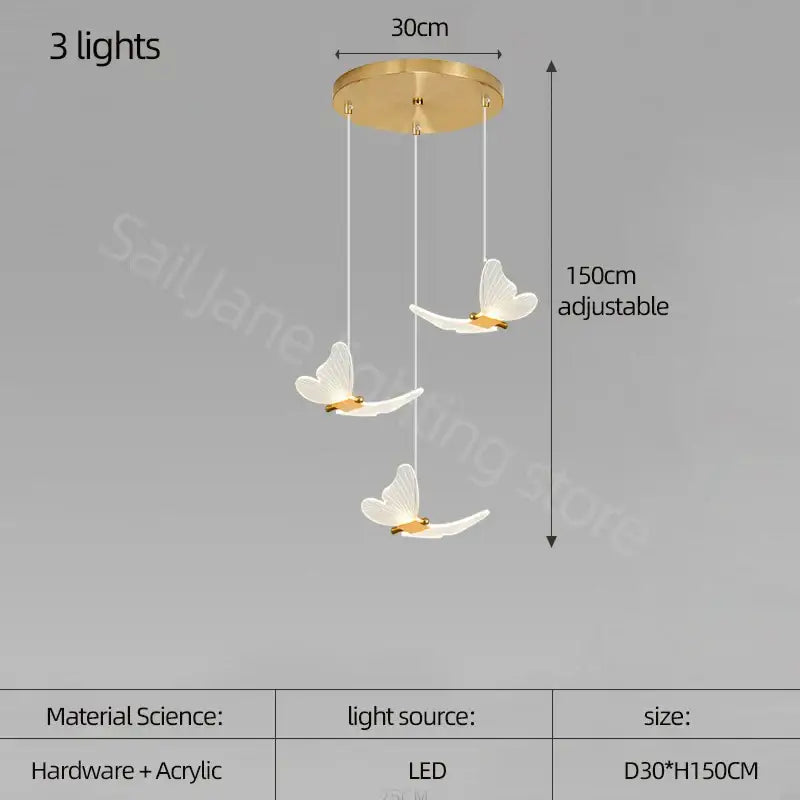 Modern golden butterfly led chandelier with gold-toned ceiling fixture and three white acrylic butterfly led lights suspended by cords