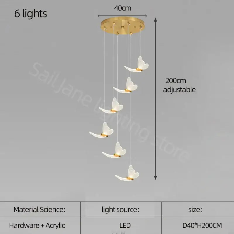 A modern golden butterfly led chandelier with six white acrylic butterfly lamps on a gold-toned circular base