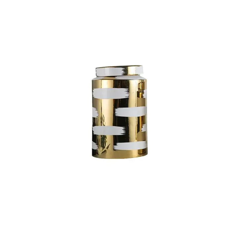 A decorbites golden ceramic cylindrical jar with glossy finish and white brushstroke stripes for living room storage