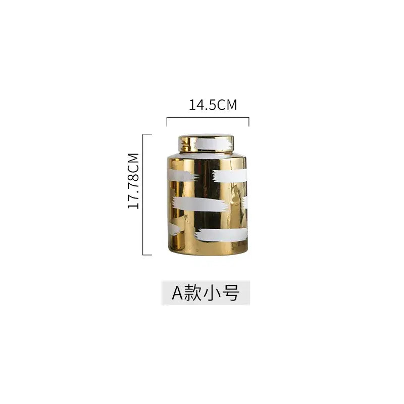 A sleek decorbites golden ceramic jar with white brushstroke stripes and a matching metallic lid for living room storage
