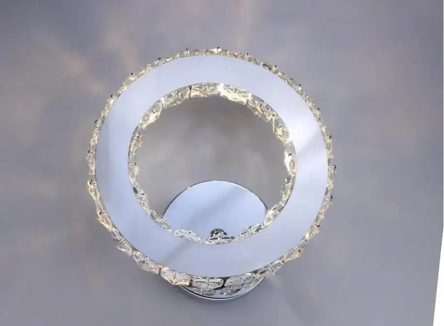 Modern golden chrome crystal led wall sconce with sleek chrome base and faceted clear crystals for decorbites chrome crystal decor