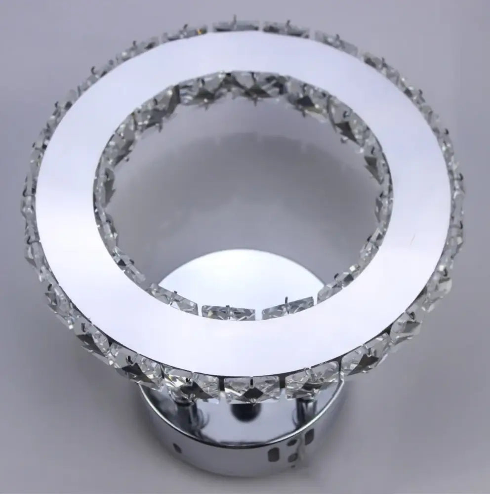 Modern golden chrome crystal led wall sconce with circular chrome finish and clear faceted crystal decorbites chrome crystal accents