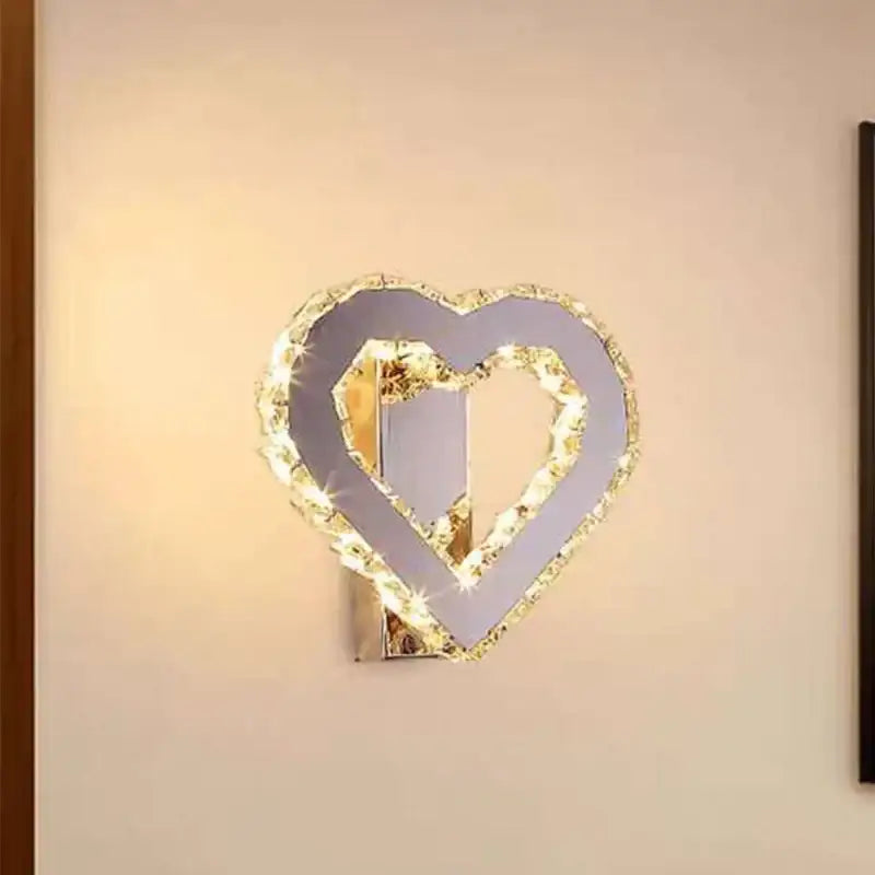 Modern golden chrome crystal led wall sconce with heart shape, mirrored interior, and sparkling decorbites chrome crystal frame