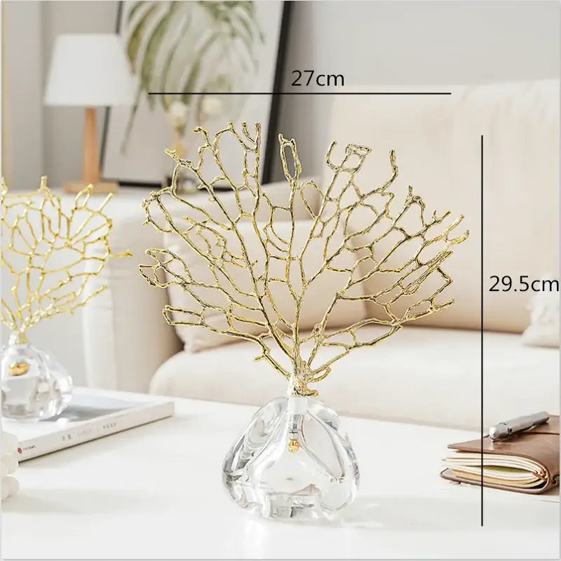Modern golden coral home decor sculpture made of crystal metal with a clear glass base by decorbites