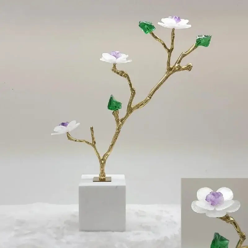Modern golden crystal flower tree sculpture with white blossoms purple centers green gemstone leaves on marble base decorbites tree sculpture decor