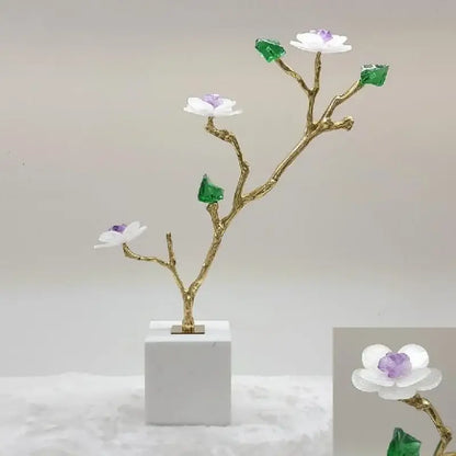 Modern golden crystal flower tree sculpture with white blossoms purple centers green gemstone leaves on marble base decorbites tree sculpture decor