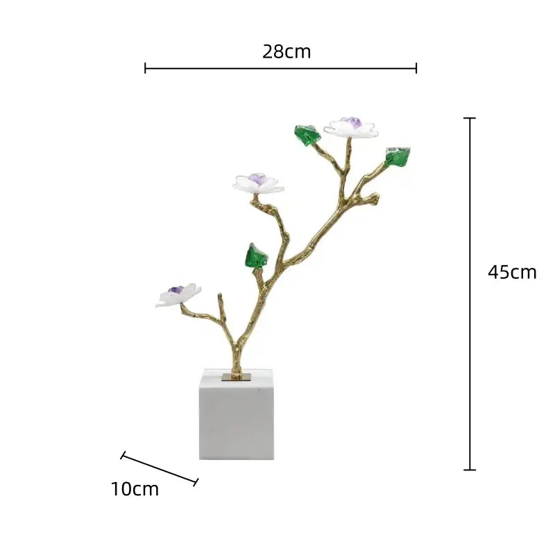 Elegant gold-toned modern crystal flower tree sculpture with white blossoms and green gemstone leaves on marble base decorbites tree sculpture