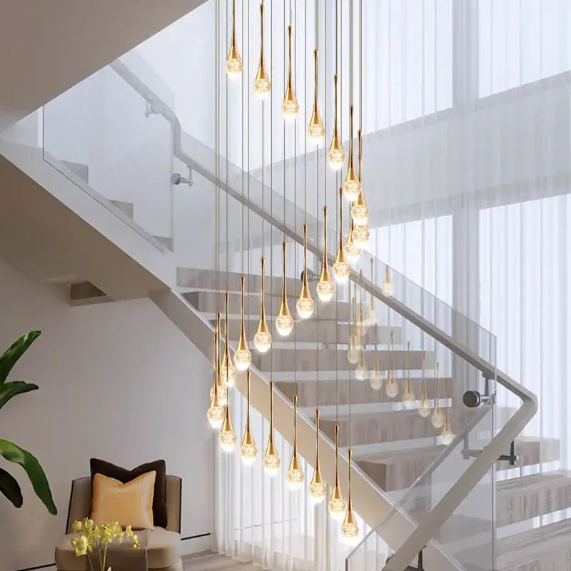 Modern golden crystal led staircase chandelier with teardrop pendant lights for lobby decorbites crystal led lighting